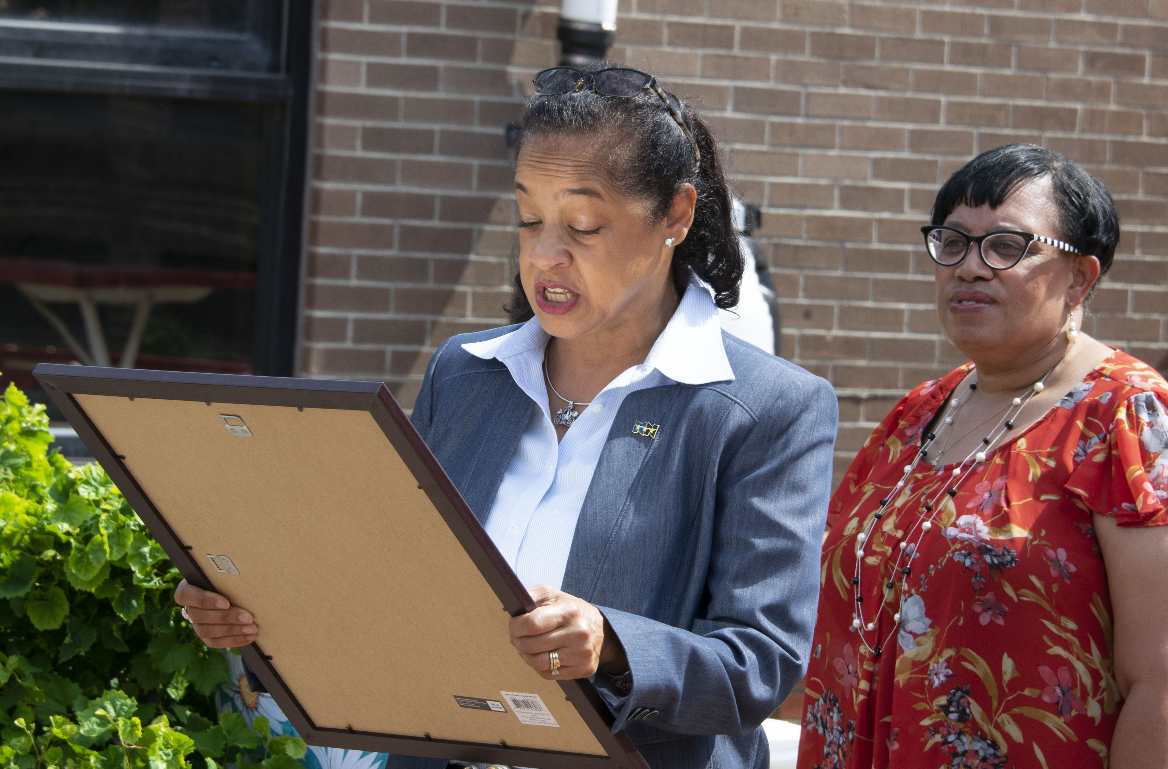 Newport News School Board Vice Chair Lisa Surles-Law read the official proclamation while Dr. Melody Camm, Palmer Elementary principal, looked on.