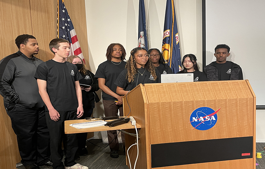 Emerging Leader Institute members, participating in a specially designed experiential learning opportunity designed by NASA Langley Research Center leadership, share their findings after a moon exploration simulation.