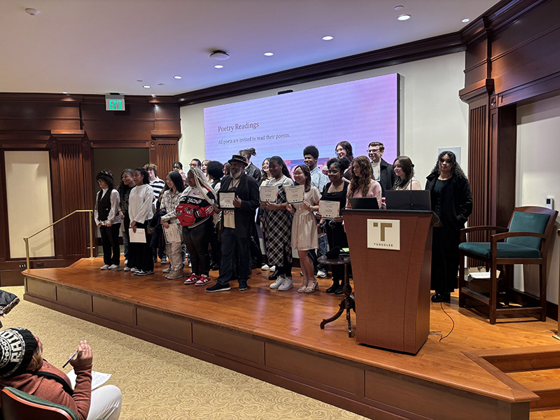 Students who participated in Artistic Verses with local poet Nathan Richardson (front row, center), who served as workshop facilitator