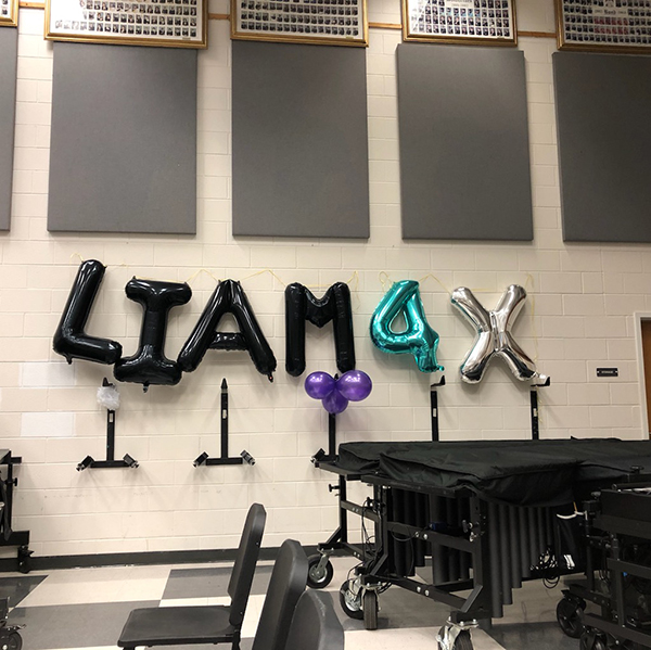 Four says it all in the Woodside band room during Liam Barnstead's festivities